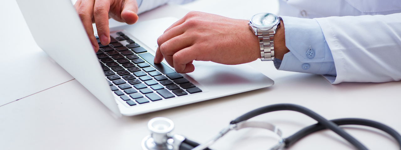 A photo of healthcare professional on a computer