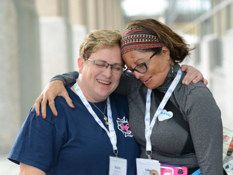 Two survivors hugging.